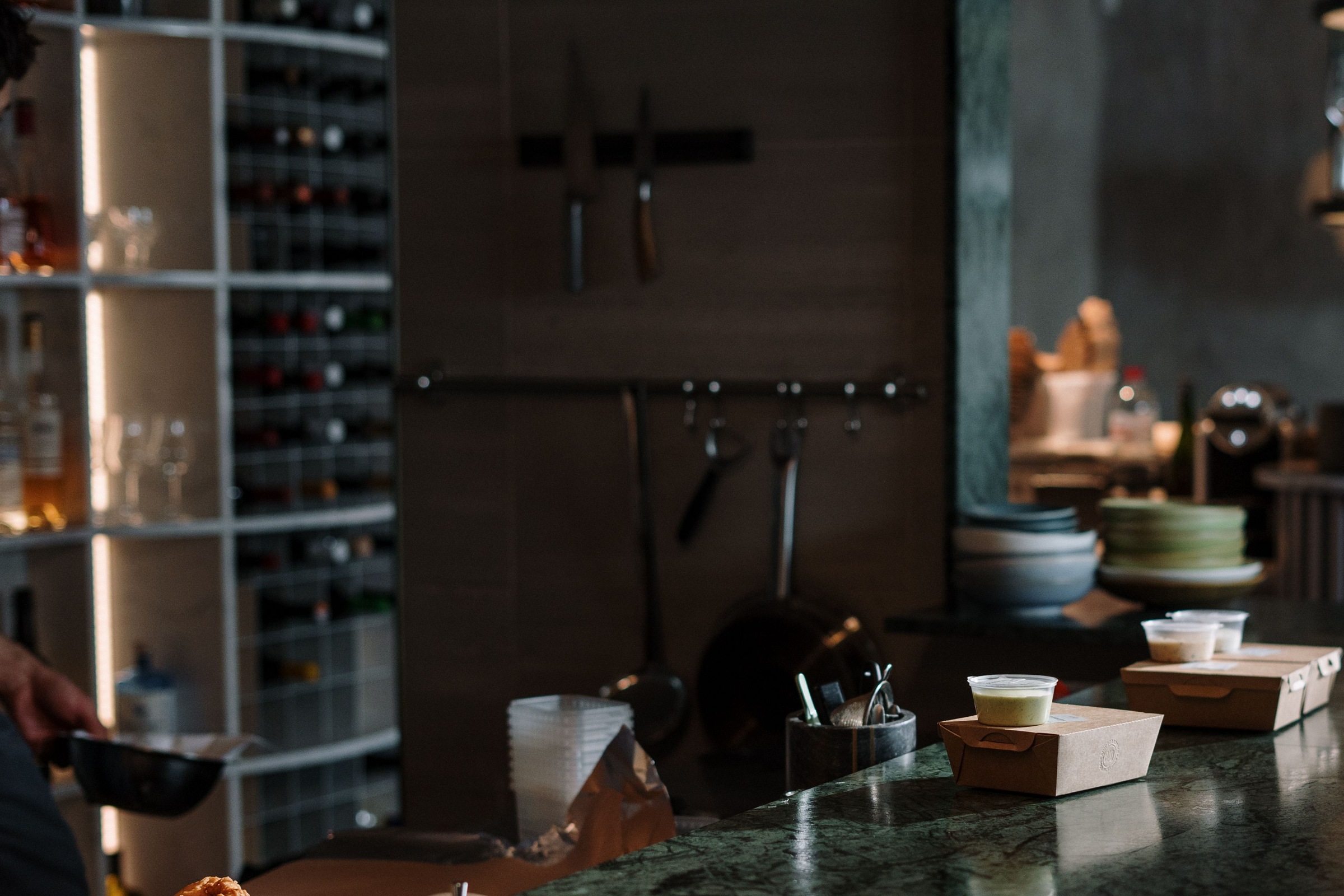 A marble bar counter at the end of service.